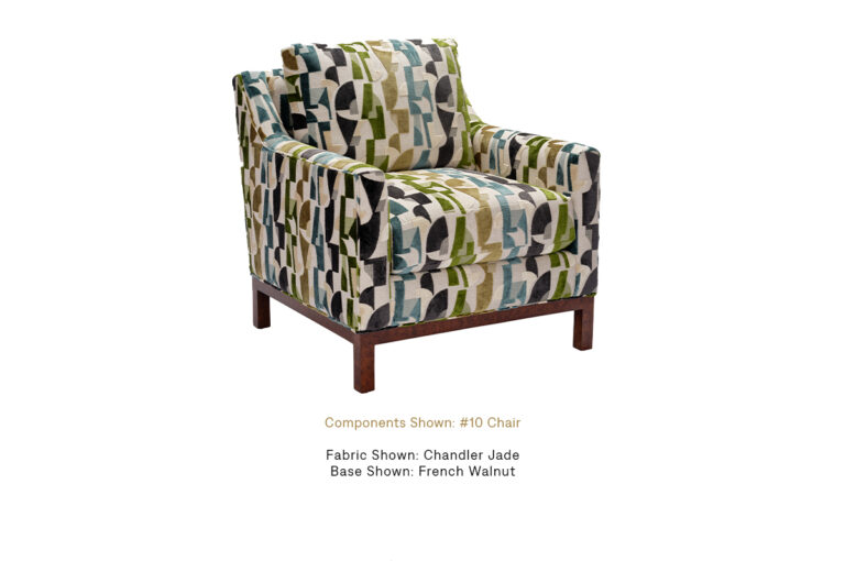 The Brendan Chair with French Walnut finish by Burton James, upholstered in Chandler Jade.