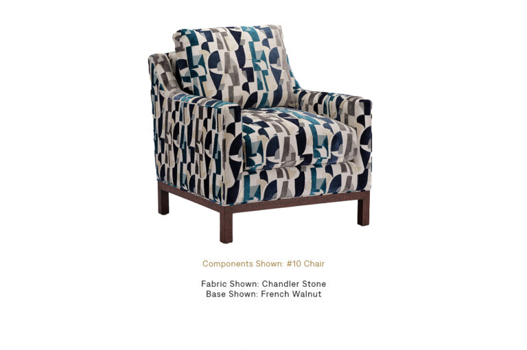 The Brendan Chair with French Walnut finish by Burton James, upholstered in Chandler Stone.